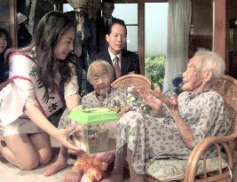 Japanese twins get crickets for 107th birthday